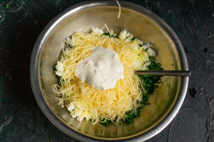 Mixing in the soft cream cheese Soft cream cheese added to the filling ingredients