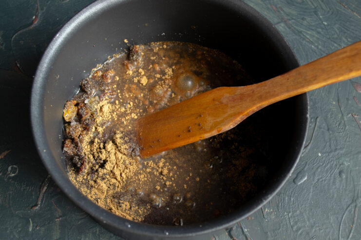 Simmering the Filling Simmering poppy seed mixture with ground cinnamon in a saucepan
