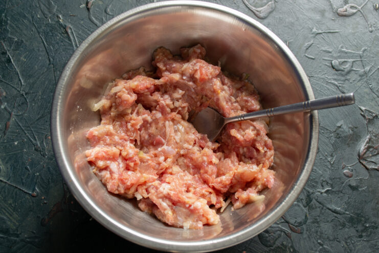 Ready meat mixture Kneaded ground meat mixture in a mixing bowl