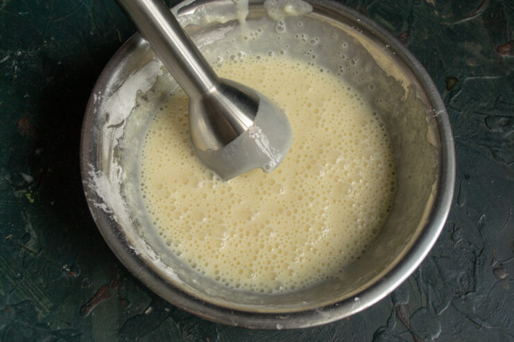 Blending the filling Blending the ricotta filling with an immersion blender until smooth