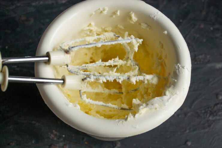 Preparing the mousse base Whipping mascarpone cheese with powdered sugar
