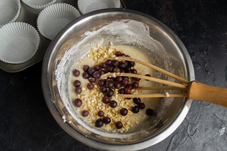 Fresh red gooseberries mixed into the muffin batter
