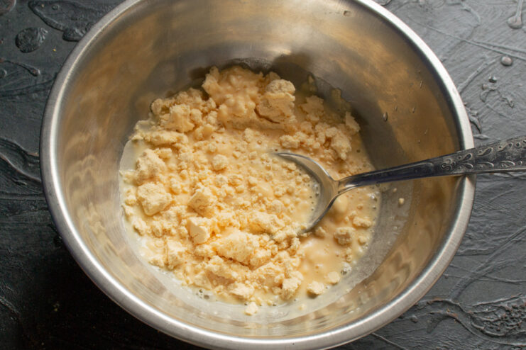 Preparing the binder Egg powder whisked with heavy cream and water in a small bowl.