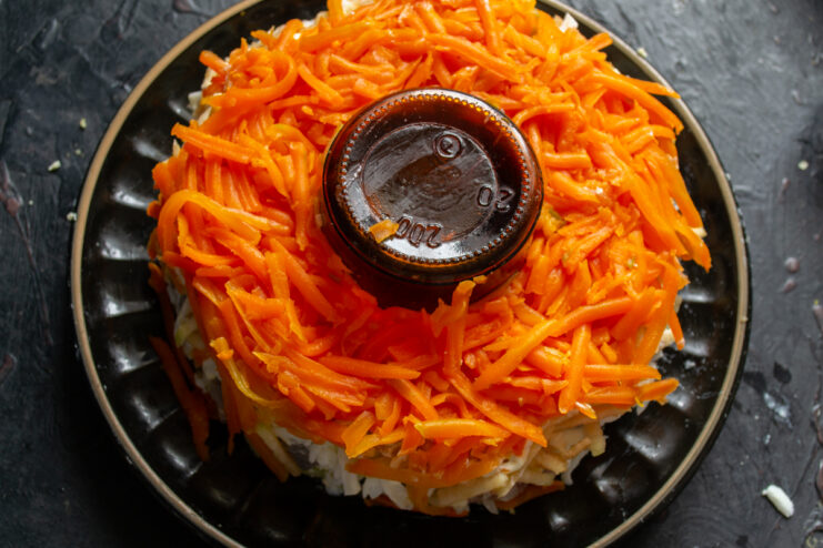Carrot layer Bright orange layer of grated boiled carrots in a salad