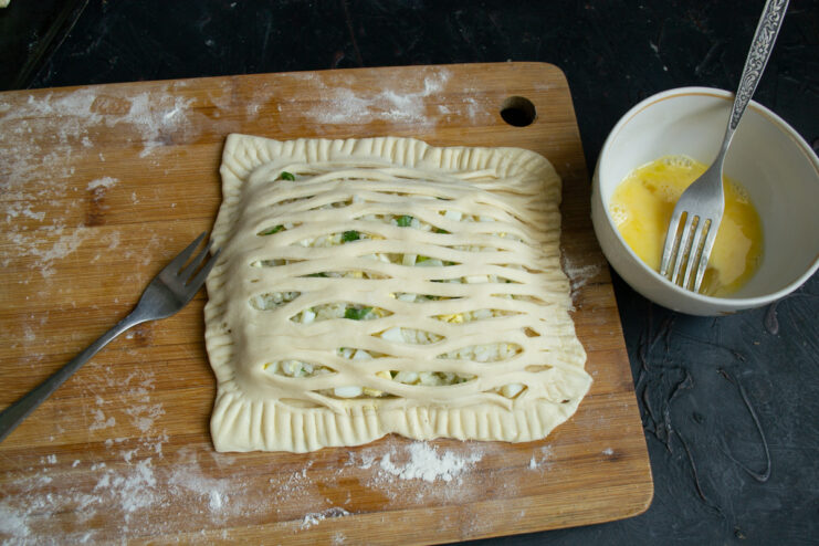 Sealed pastry pie with a stretched lattice pattern on top