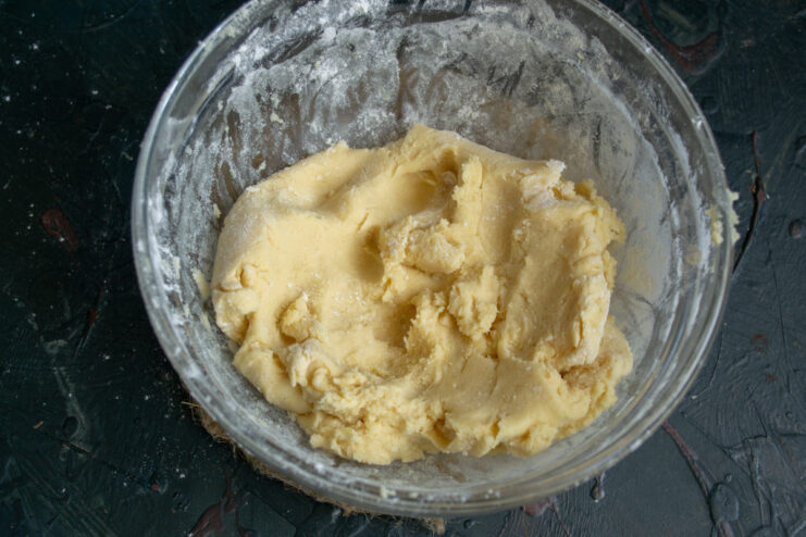 Smooth and soft mixed cookie dough in a glass bowl