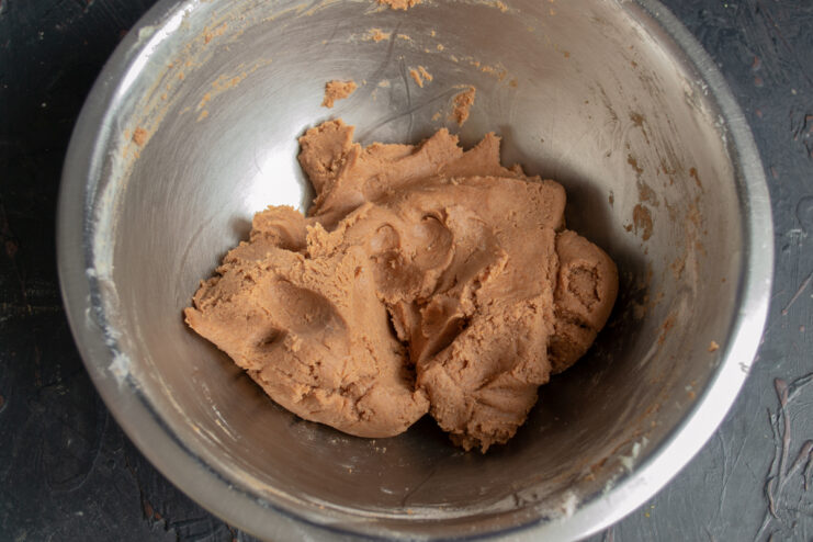 Kneaded chocolate shortbread dough in a bowl.
