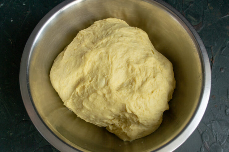 Kneading the Dough Kneaded ball of yeast dough in a deep bowl