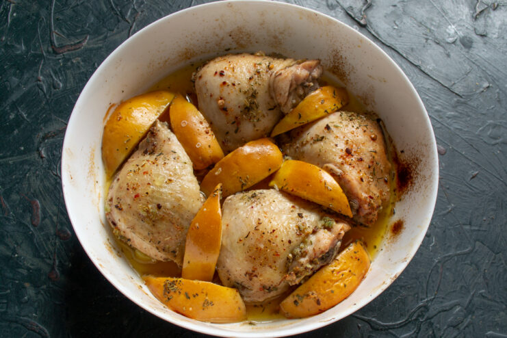 Intermediate Roasting Step Baked chicken with fruit after the first roasting stage