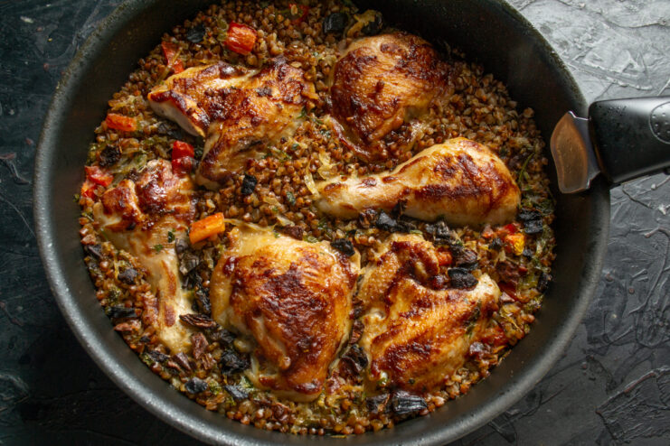 Final Baked Result Baked chicken with buckwheat in a skillet out of the oven