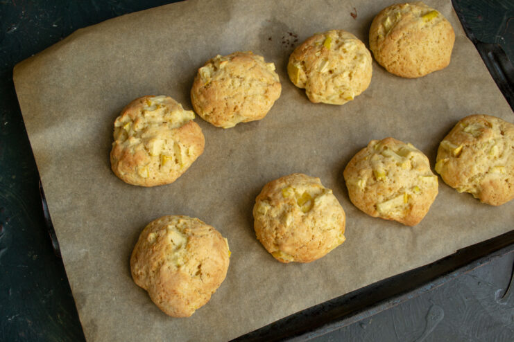 Freshly baked golden apple cookies on a baking tray