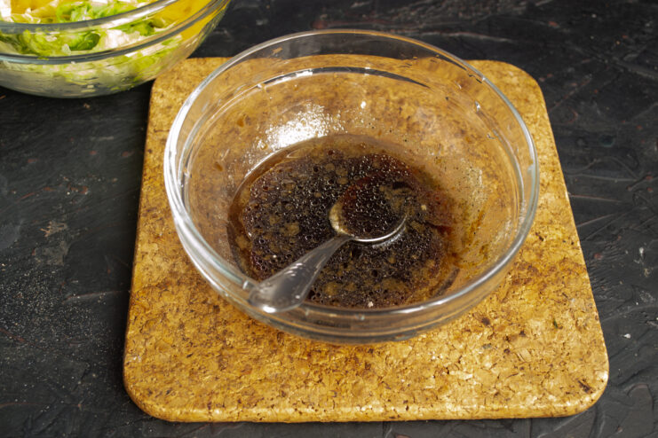 Mixing the dressing Soy sauce, red wine vinegar, and olive oil dressing in a small bowl