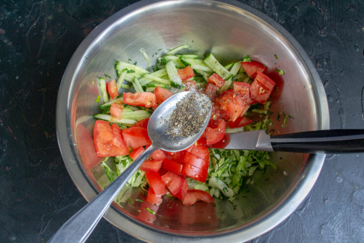 Seasoning the Vegetables Seasoning the fresh vegetable mix with salt and freshly ground black pepper.