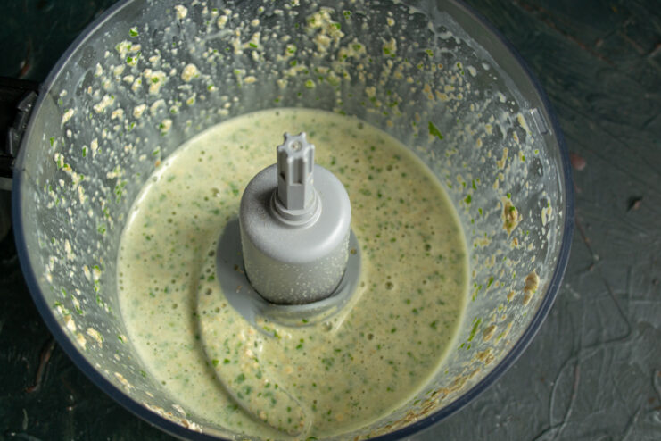 Blended spinach batter Smooth green oat crepe batter in a blender