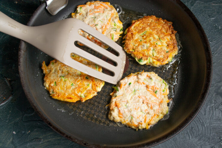 Frying the vegetable fritters Frying vegetable fritters in a hot skillet