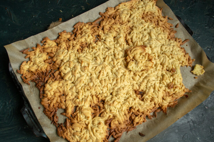 Baked base Golden brown baked grated dough on a baking sheet