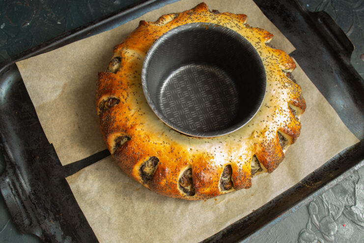 Baked Cake from the Oven Golden baked cake with a center ring mold on a baking sheet