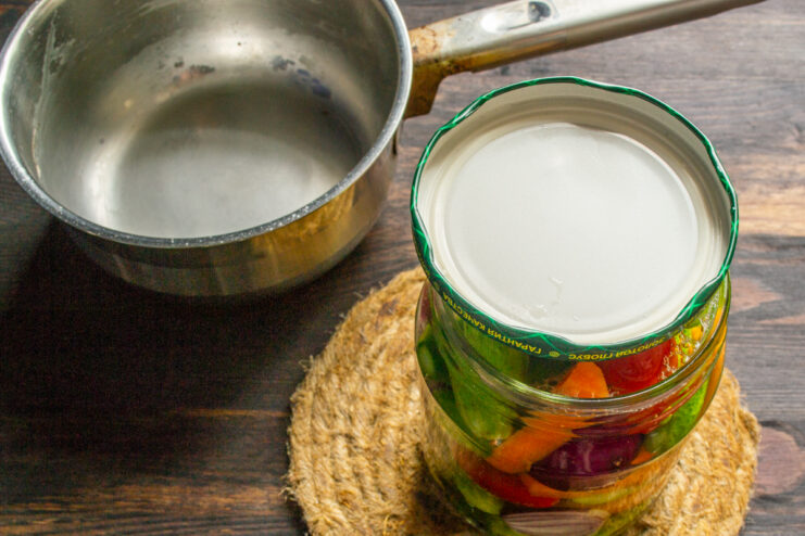 Jar of pickles covered with a metal lid