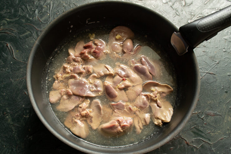 Blanching The Liver Chicken liver boiling in salted water inside a pot