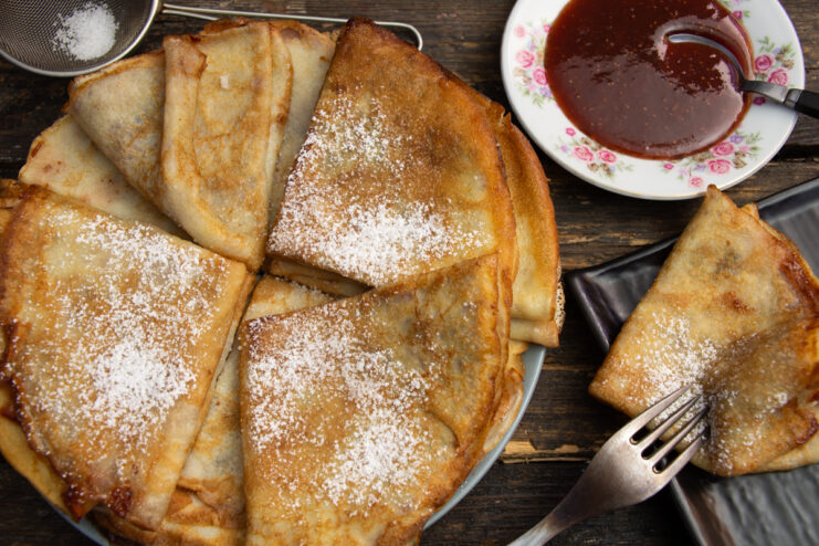 Jam-filled crepes dusted with powdered sugar