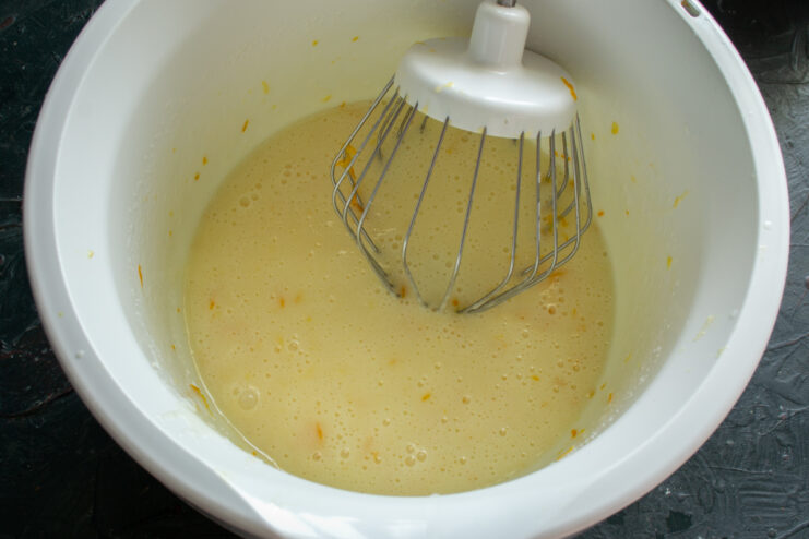 Wet ingredients and zest Adding orange juice oil and zest into the batter
