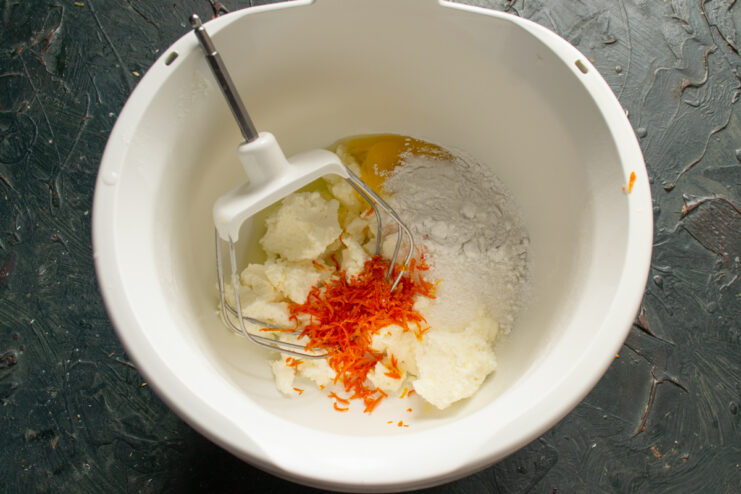 Adding freshly grated orange zest and juice to the cheese mixture