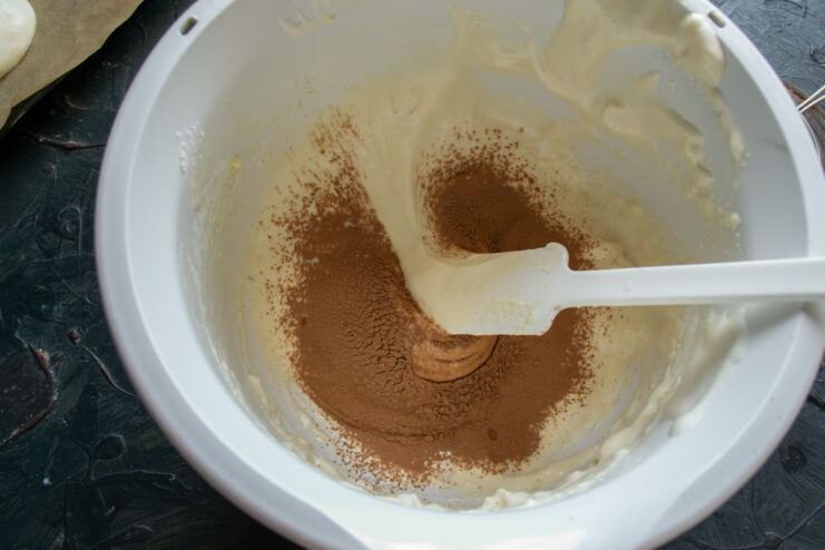 Preparing the chocolate batter Mixing cocoa powder into the sponge cake batter