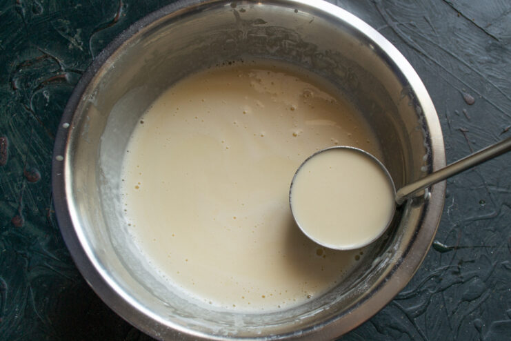 Pouring boiling water into resting crepe batter
