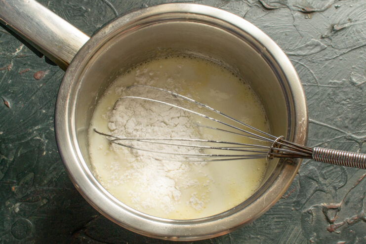 Thickening the Cream Adding starch to the milk and egg mixture