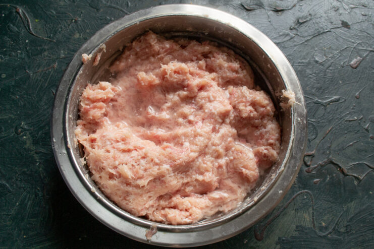 The secret to juicy patties is ice water Pouring ice-cold water into the bowl of minced meat
