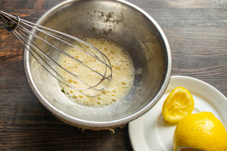Adding lemon juice to beaten eggs