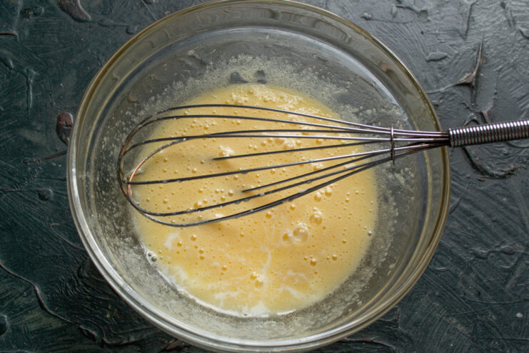 Adding Liquid Ingredients Pouring milk or cultured dairy into the sweet egg mixture