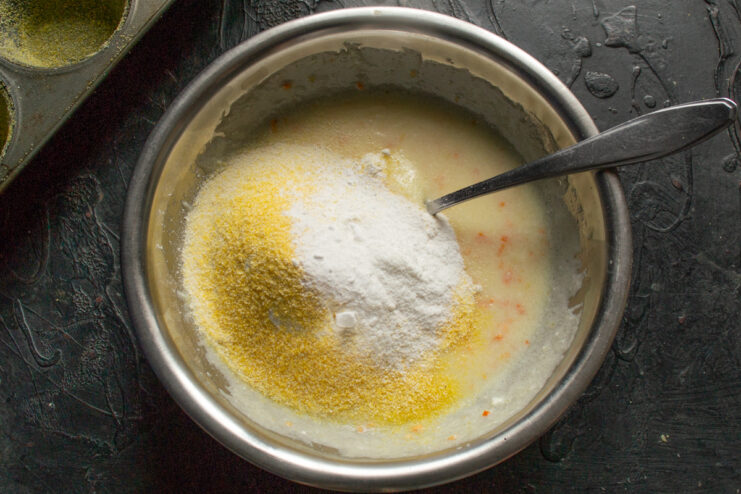 Adding dry ingredients Adding wheat flour, corn polenta, and semolina to the batter base