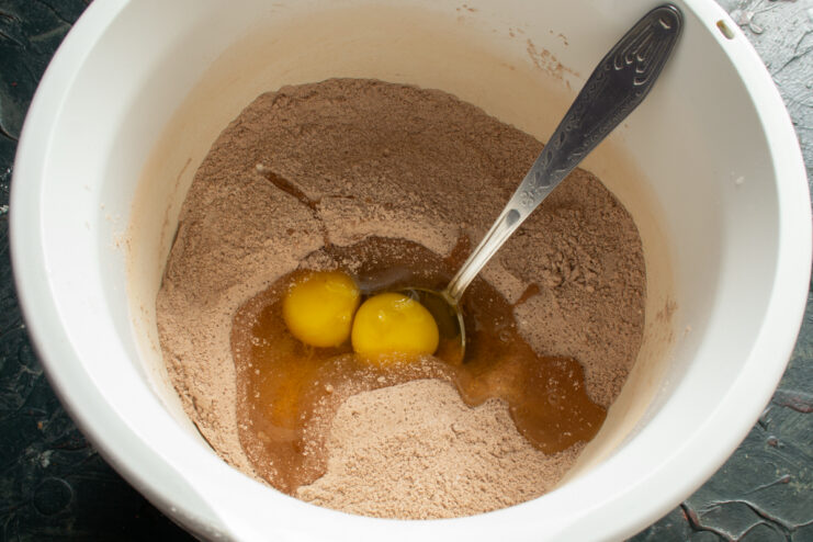 Mixing the Batter Adding eggs to the dry mixture