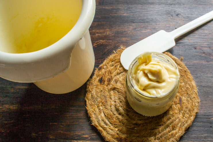 Finished homemade sauce Homemade honey mustard mayonnaise in a small clear glass jar