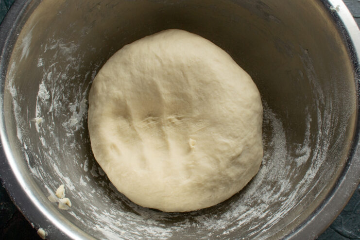 Smooth and elastic ball of dough resting in a bowl