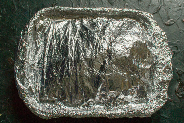 Prepping for the Oven Baking dish tightly covered with aluminum foil