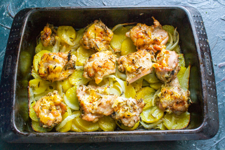 Freshly baked herb-roasted chicken with potatoes