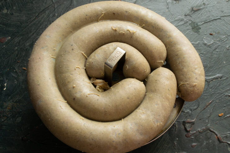 Steamed Sausage Result Cooked liver sausage resting inside a steamer basket