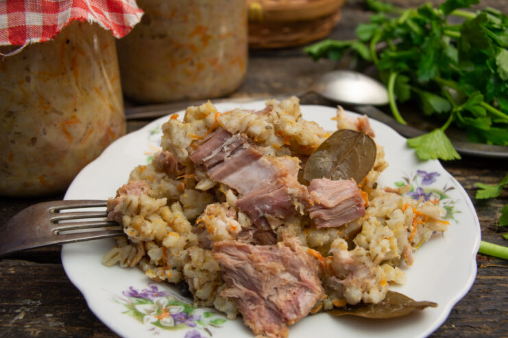 Prepared homemade pork stew with pearl barley on a plate