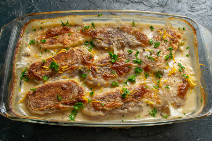 The Final Result Baked fish patties garnished with fresh parsley in a dish