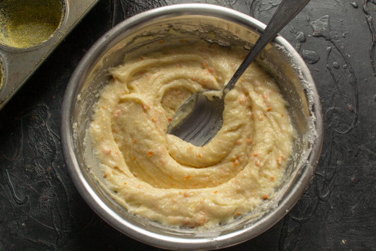 Resting the muffin batter Muffin batter resting in a bowl to allow polenta and semolina to swell