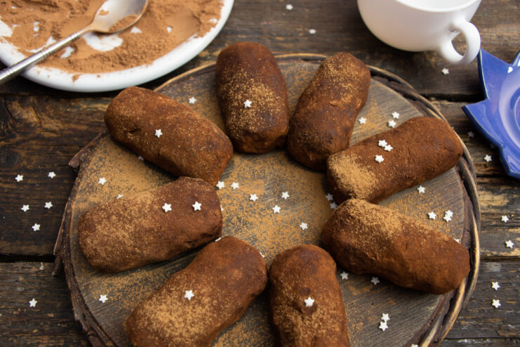 Finished chocolate Nochka pastry on a wooden stand.
