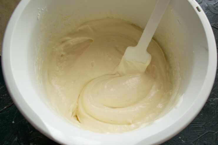 Mixing the batter Smooth and airy vanilla sponge cake batter in a bowl