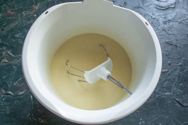 Mixing The Batter Smooth semolina batter resting in a stand mixer bowl