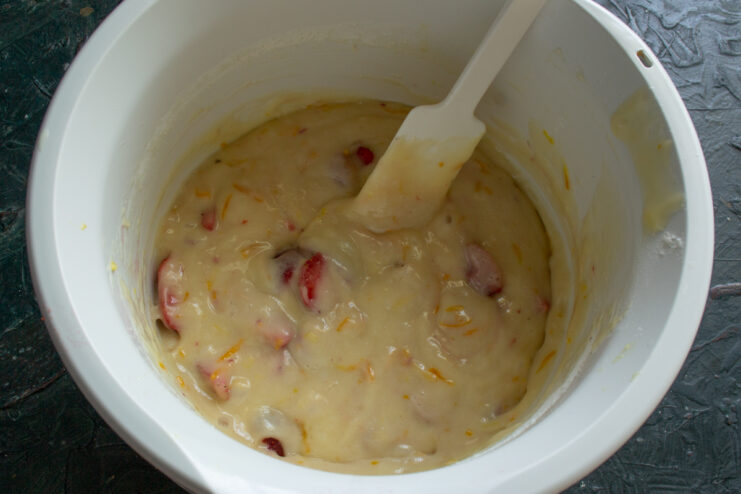 Folding berries into the batter Finished batter with strawberries mixed with a spatula
