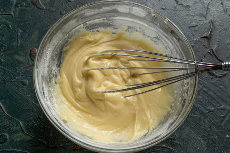Resting the Batter Smooth and uniform bun batter resting in a mixing bowl