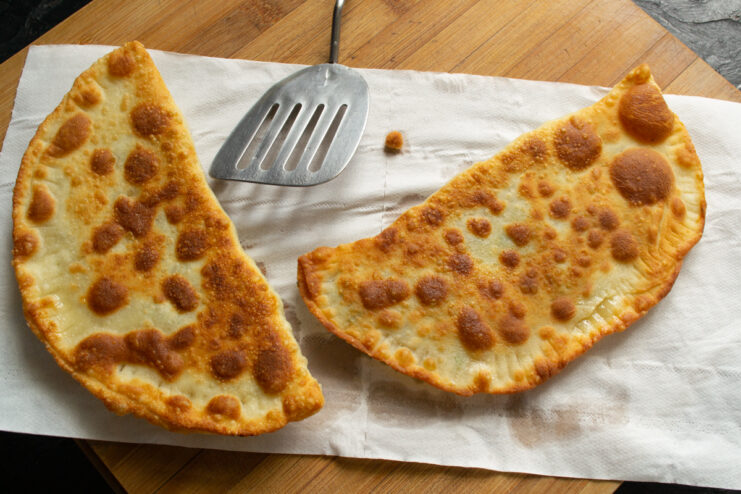 Draining Excess Oil Fried khachapuri draining on a paper towel