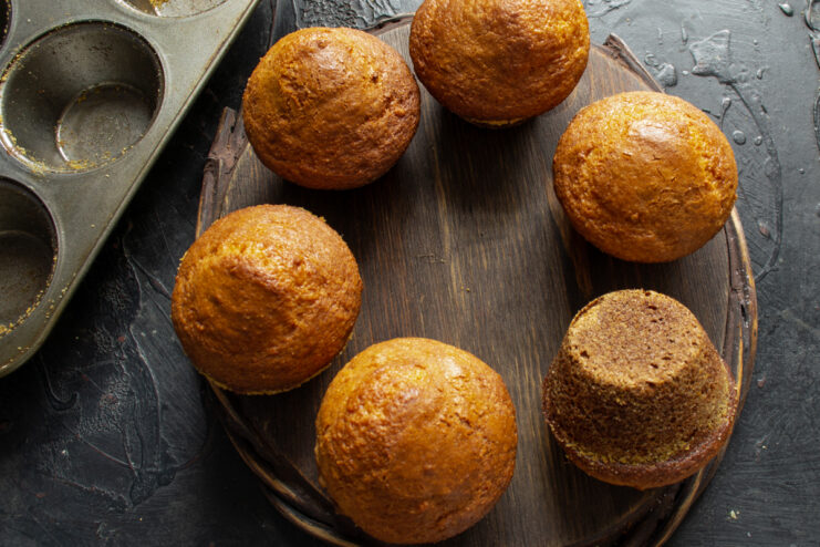Cooling and removing the muffins Freshly baked muffins cooling down after being removed from the metal tin