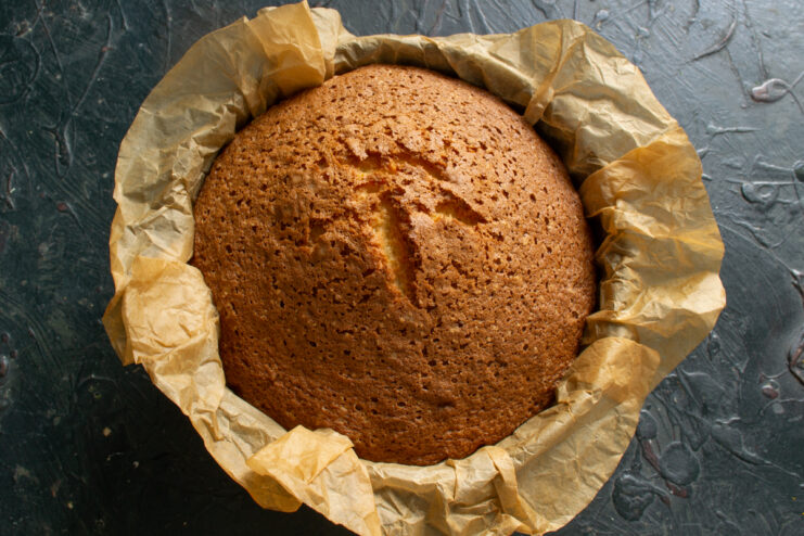 Baked sponge cake layer Golden baked sponge cake cooling inside the baking pan